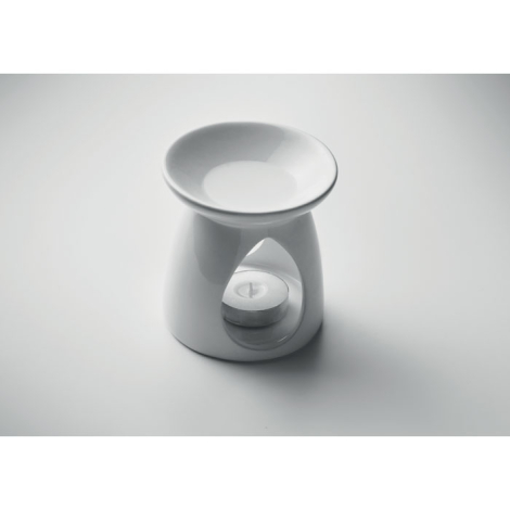 Vue en perspective du brûleur de parfum en céramique blanche avec sa coupelle supérieure et une bougie chauffe-plat placée dans 