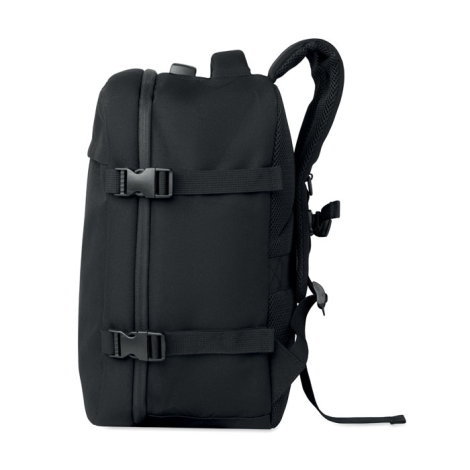 Vue de profil du sac à dos noir montrant son épaisseur, ses deux sangles de compression latérales à boucles et une bretelle remb