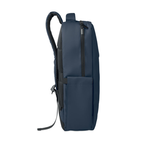 Vue de profil d'un sac à dos bleu marine, montrant son épaisseur, une fermeture éclair sur le dessus et une poche latérale ouver