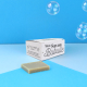 Savon solide rectangulaire avec boîte en papier ensemencé « Mon Savon Bubulle », présenté sur fond bleu avec des bulles de savon