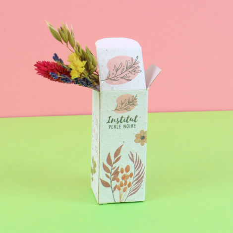 Coffret de fleurs séchées personnalisé en papier à planter, présenté ouvert à l'horizontale avec son bouquet et ses instructions