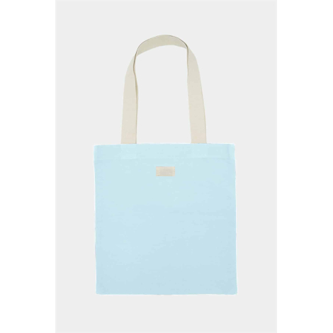 Tote bag Nina bleu azur uni avec deux longues anses écrues et une petite étiquette rectangulaire écrue au centre de la partie su