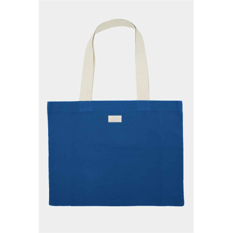 Cabas Nina bleu roi avec deux longues anses écrues et une petite étiquette rectangulaire blanche positionnée au centre, près du 