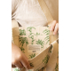 Vue détaillée de la poche intérieure du cabas Nina à motifs palmiers verts, avec étiquette Studio by Hindbag et anses écrues.