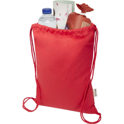 Sac publicitaire rouge en coton recyclé rempli de produits du quotidien