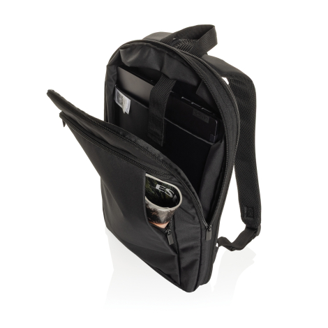 Sac à dos noir ouvert avec ordinateur, documents et poche avant zippée.