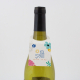 Collerette en papier à inclusions sur bouteille, personnalisation couleur visible sur la face avant.