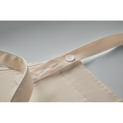 Zoom sur la sangle réglable du cou avec bouton et boutonnières.
