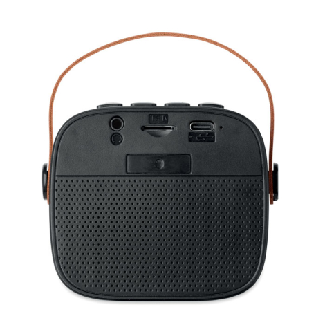 Enceinte sans fil noire 5 W vue de dos, connectiques visibles et poignée marron.
