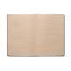 Carnet A5 ouvert montrant des pages lignées de teinte beige.