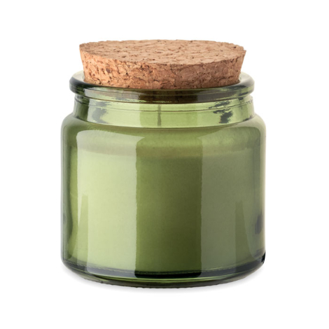 Bougie verte en cire végétale dans un pot en verre teinté, couvercle en liège posé.