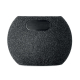 Vue arrière d’une enceinte sans fil ronde noire montrant l’interrupteur et le port de charge.