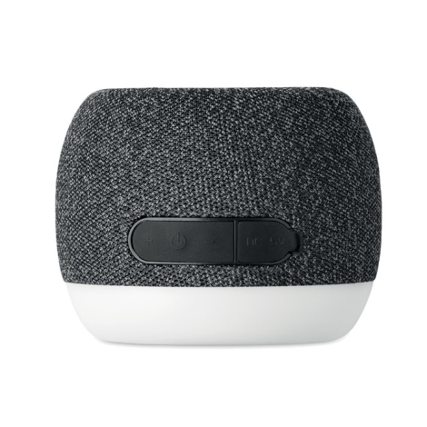 Vue arrière de l’enceinte ronde montrant les boutons de commande et le port de charge.
