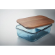 Lunch box en verre bleu translucide avec couvercle en bois légèrement entrouvert, sans personnalisation visible.