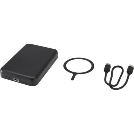 Batterie noire accompagnée d’un câble USB-C et d’un anneau magnétique posés à côté.