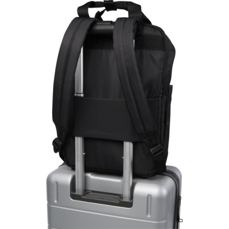 Vue arrière d’un sac noir fixé sur la poignée télescopique d’une valise grâce à une sangle horizontale.