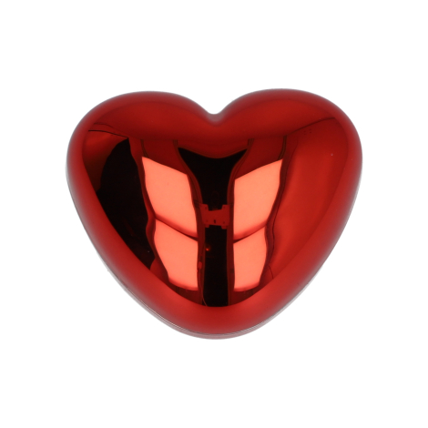 Boîtier en forme de cœur de couleur rouge présenté fermé, sans marquage apparent.