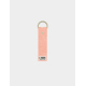 Porte-clés publicitaire en coton bio rose corail avec personnalisation en bas de lanière