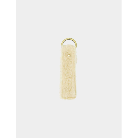 Porte-clés effet moumoute écrue présenté verticalement sans personnalisation visible.