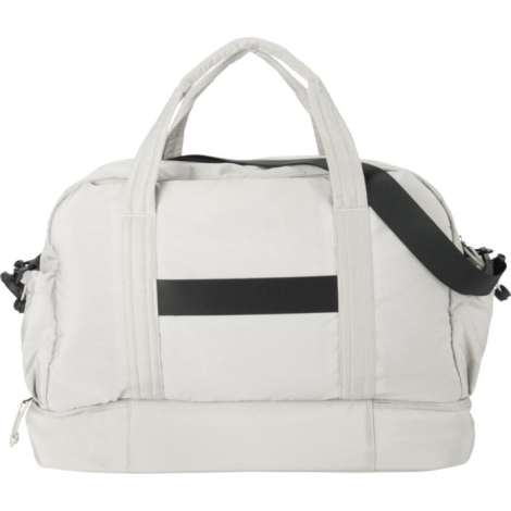 Vue arrière d’un sac de sport beige montrant poignées et bande horizontale, sans marquage visible.