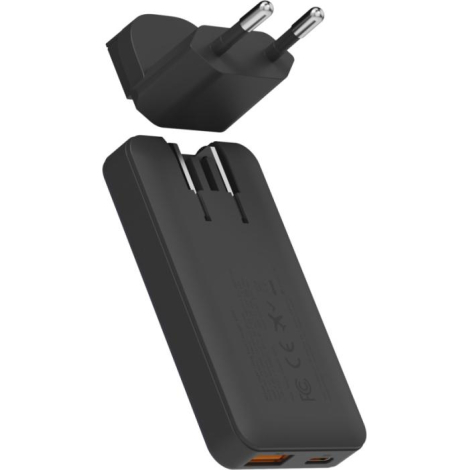 Adaptateur secteur détaché au-dessus du chargeur montrant le système d’insertion, sans personnalisation apparente.