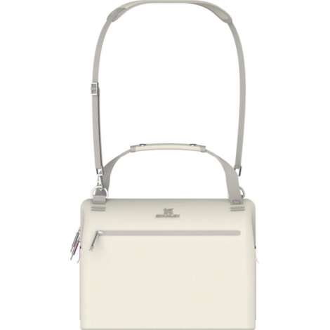 Sac isotherme beige présenté de face avec bandoulière portée en position haute, sans marquage apparent sur la poche avant.